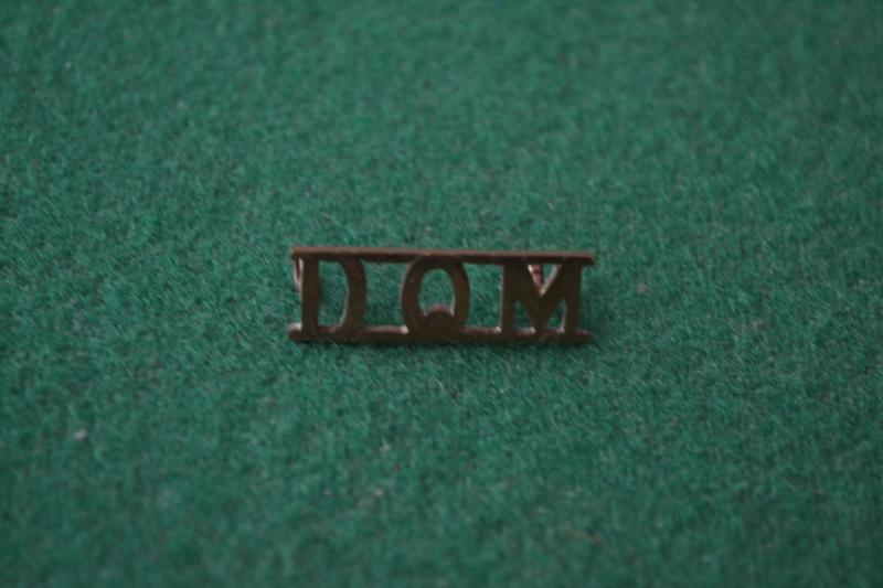 D.Q.M. Shoulder title